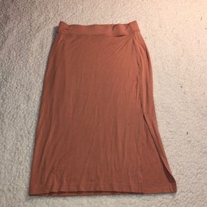 A peach colored pencil skirt